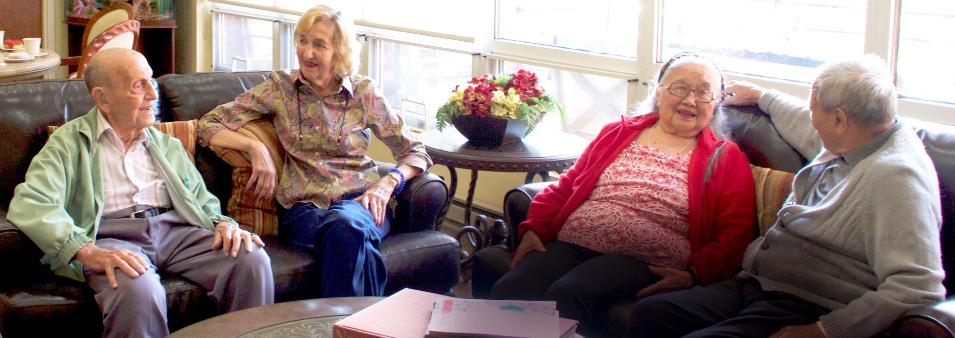 Three elderly people relaxing together