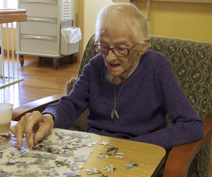 A resident working on a puzzle